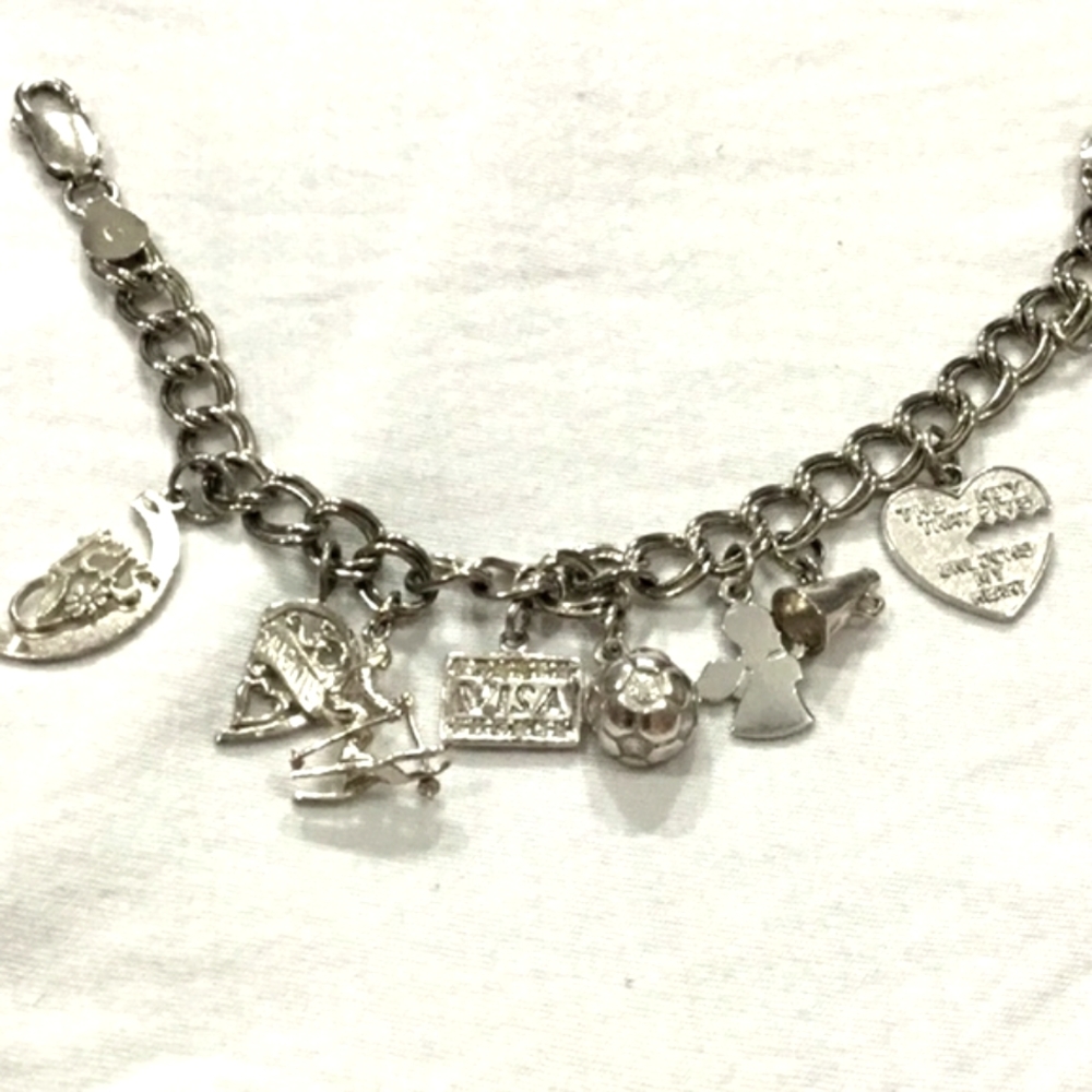 Sterling Silver charm bracelet.nice weight
